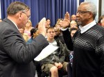 Superintendent Tom Seigel giving the oath of office to Warren Smith